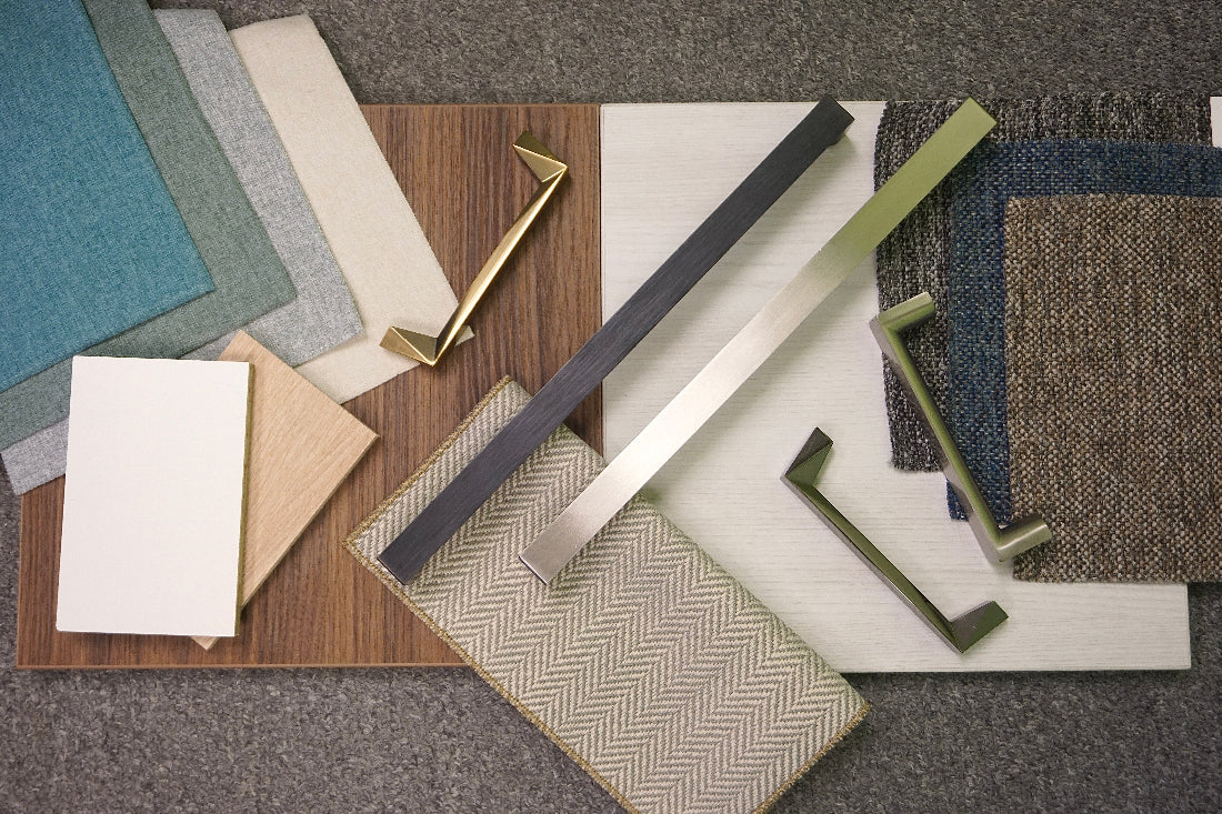 Collection of various wood and metal samples on a textured surface