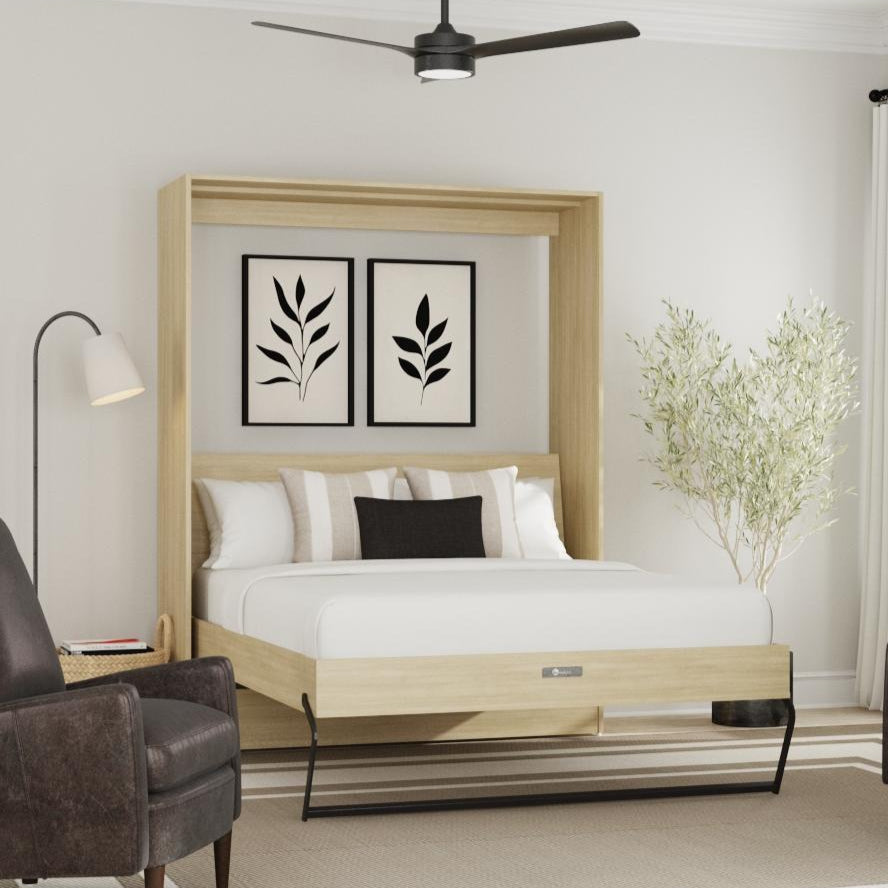 Modern bedroom with a wooden Murphy bed, armchairs, and decorative elements.