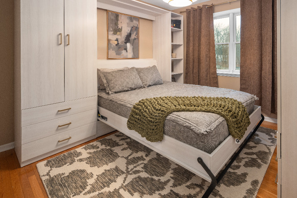 Bedroom with a murphy bed, wardrobe, and window