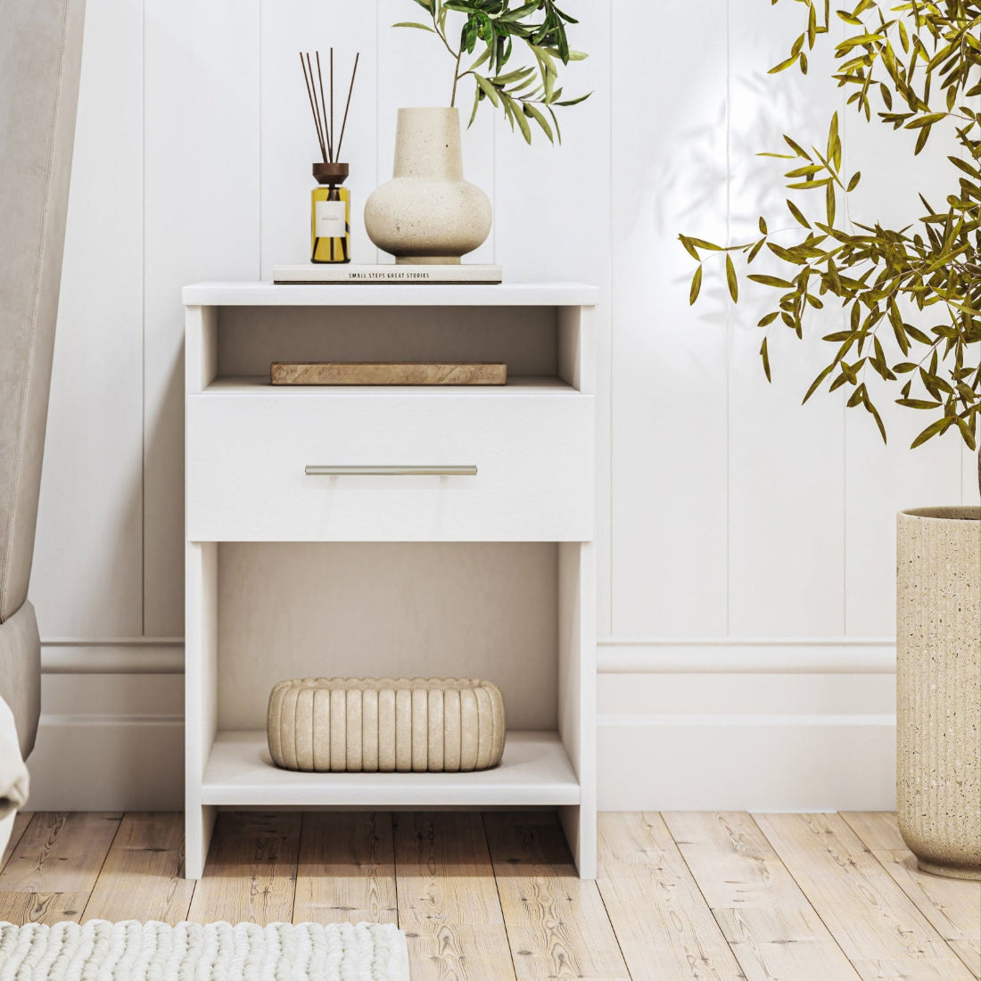 white nightstand, and decorative items.