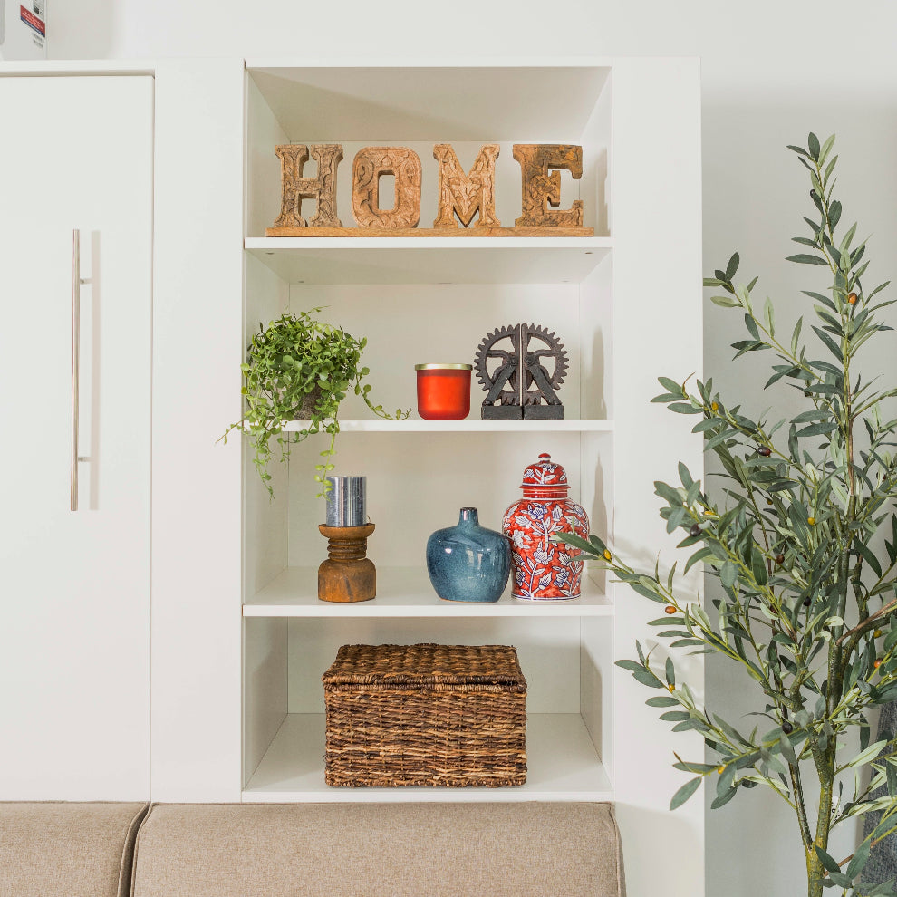 Shelves decorated with vases and a plant