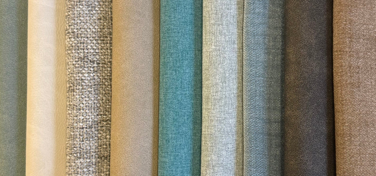 Stripes of various textured fabric swatches in neutral colors.