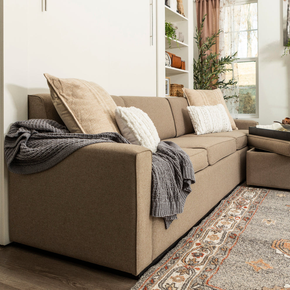 View of a sofa wall bed from the side, showing all 3 seats. 