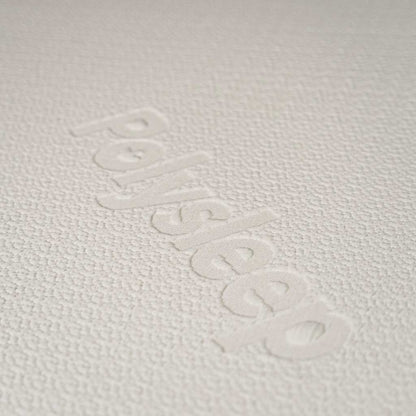 fabric close up of Polysleep mattress that reads Polysleep