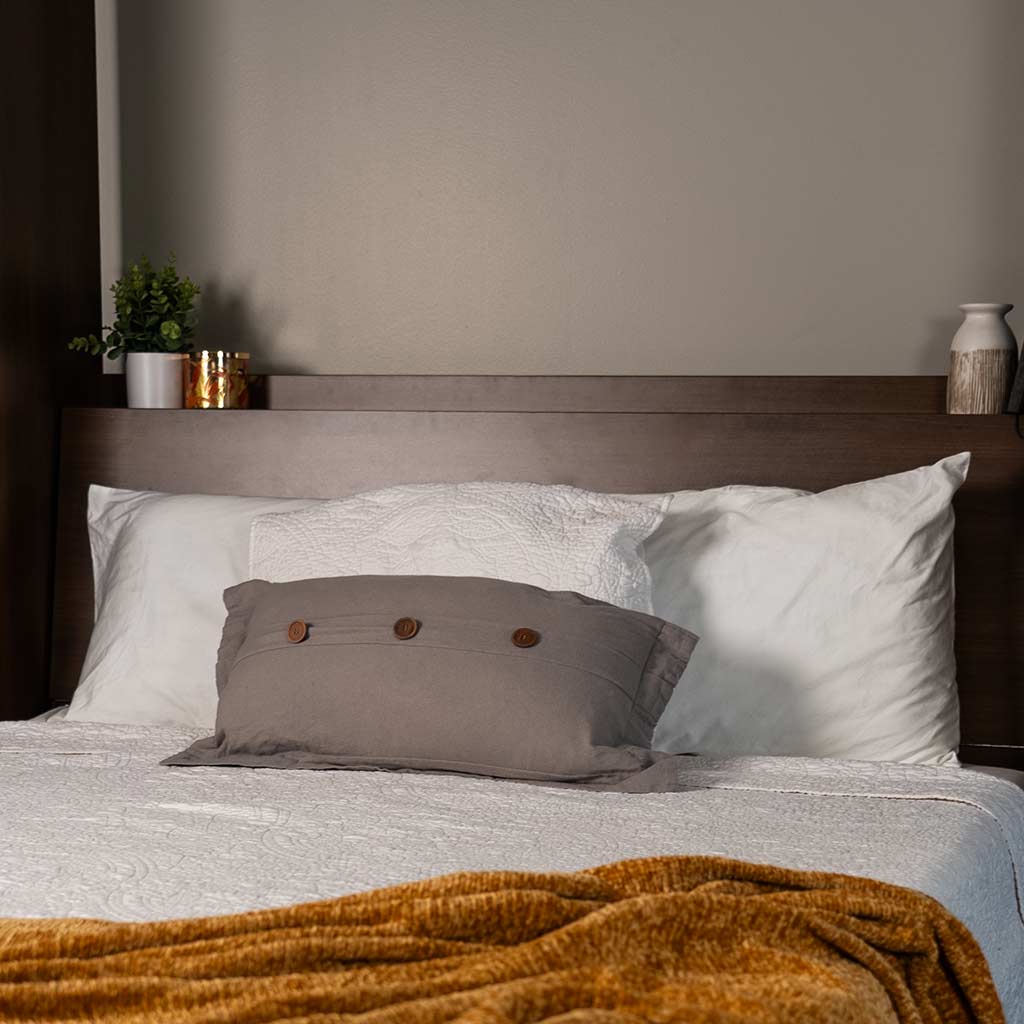 Close up of Medium Walnut Wall Bed with Table showing headboard that unlatches.