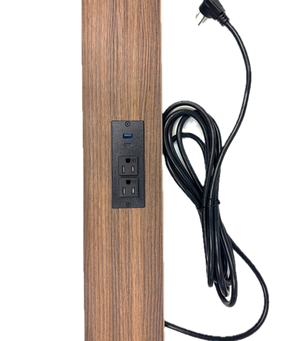 Wooden panel with electrical outlets and a black power cord on a white background